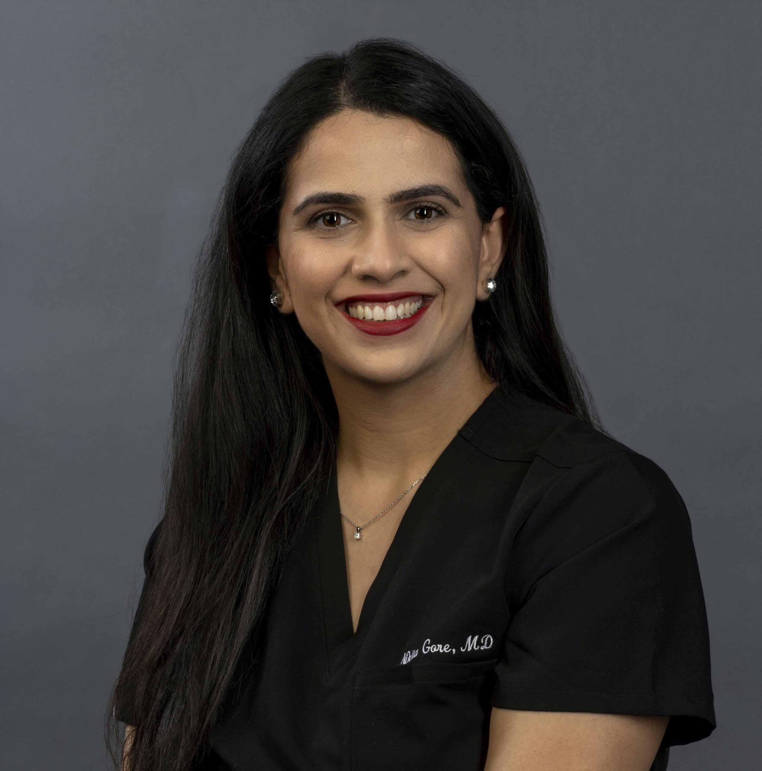 Dr. Nikita Gore with patient at The Gore Medical Group